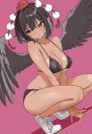  1girl alternate_costume bikini bird_wings black_bikini black_wings blush breasts cleavage closed_mouth collarbone commentary_request covered_nipples feathered_wings hat highres large_breasts medium_hair pink_background pointy_ears pom_pom_(clothes) red_eyes red_hat shameimaru_aya shoes simple_background sneakers soara_shimomo solo squatting sweat swimsuit tan thighs tokin_hat touhou white_shoes wings 
