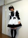  black_legwear copyright_request cosplay long_sleeves maid photo short_hair smile solo standing thighhighs 