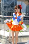  aino_minako bishoujo_senshi_sailor_moon bow choker cosplay curtsey jewelry_star_bracelet magical_girl orange_choker orange_sailor_collar orange_skirt photo red_bow sailor_collar sailor_senshi_uniform sailor_venus skirt solo 