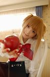  amane_misa apple bangs cosplay death_note food fruit holding holding_food holding_fruit photo solo two_side_up 