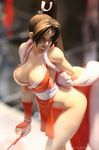 breasts brown_eyes brown_hair cleavage closed_fan fan fatal_fury figure folding_fan large_breasts long_hair pelvic_curtain photo ponytail revealing_clothes shiranui_mai snk solo the_king_of_fighters watermark wonder_festival wonder_festival_2007 