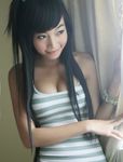  asian black_hair cleavage elly_tran_ha long_hair photo smile 