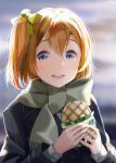  1girl :d black_coat blonde_hair blue_eyes blurry blurry_background bow food green_bow hair_between_eyes hair_bow highres holding holding_food kousaka_honoka long_sleeves looking_at_viewer love_live! love_live!_school_idol_project megumi_cv open_mouth scarf short_hair side_ponytail smile solo upper_body 