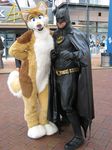  2009 batman blue_eyes canine cosplay couple dingo dog female fursuit male mask photo pose public rarakie rarakie_(character) real serious smile standing tail wolf 