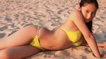  1girl asian beach bikini curvy highres hips irie_saaya junior_idol looking_at_viewer outdoors photo real saaya_irie sand solo swimsuit 