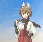  animal_ears blush brown_eyes brown_hair camera dog_ears goggles goggles_on_head japanese_clothes katou_keiko mirutsu_(milts) scarf short_hair smile solo world_witches_series 