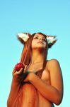  apple canine cat cosplay ears feline female fox horo nude ookami_to_koushinryou outside red_hair solo vixen 