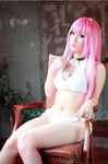  1girl akashiya_moka akashiya_moka_(cosplay) asian bikini chair cosplay long_hair midriff photo pink_hair real rosario+vampire sitting solo swimsuit 