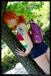  a-pumpkin against_tree ass back backpack bag bangle bare_legs blue_eyes bodypaint bracelet compass cosplay denim denim_shorts eyeliner from_side halter_top halterneck highres jewelry leaf log_pose makeup nami_(one_piece) nami_(one_piece)_(cosplay) one_piece orange_hair photo short_shorts shorts smile solo tattoo tree twintails 