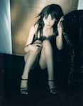  1girl asian black_hair fetal_position high_heels indoors komatsu_ayaka long_hair looking_at_viewer on_floor photo pretty_guardian_sailor_moon real shoes sitting solo 