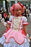  bow_(weapon) cosplay kaname_madoka lowres magical_girl mahou_shoujo_madoka_magica photo pink_hair real taiwan weapon 