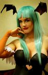  bare_shoulders breasts cosplay demon_girl green_hair head_wings jewelry large_breasts lindze lips lipstick long_hair makeup morrigan_aensland photo ring solo vampire_(game) yellow_eyes 