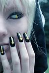  arrow blonde_hair cosplay medusa_gorgon photo real snake soul_eater witch yellow_eyes yellow_nails 
