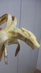  banana dragon food fruit highres holding open_mouth photo reptile sculpture y_yamaden 