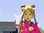  angry animated animated_gif bishoujo_senshi_sailor_moon blonde_hair brown_eyes choker costume gif gloves long_hair lowres photo pretty_guardian_sailor_moon real sailor_moon sailor_moon_(cosplay) sawai_miyuu smile tsukino_usagi twintails wink 