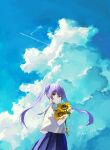  1girl absurdres blue_skirt blue_sky closed_mouth cloud cloudy_sky commentary_request cumulonimbus_cloud flower highres holding holding_flower long_hair looking_at_viewer looking_back original purple_hair school_uniform serafuku shirt skirt sky solo sunflower twintails twitter_username upper_body white_shirt yellow_eyes yos_(72112764) 