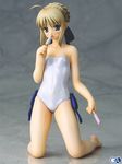  artoria_pendragon_(all) bare_shoulders blonde_hair casual_one-piece_swimsuit fate/stay_night fate_(series) figure food kneeling one-piece_swimsuit photo popsicle saber solo swimsuit 