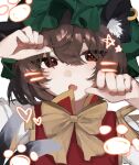  1girl :o absurdres animal_ear_piercing bow bowtie brown_eyes brown_hair cat_tail chen commentary_request earrings fang gold_trim hands_up highres jewelry looking_at_viewer momomo_twi multiple_tails nekomata open_mouth paw_pose red_vest simple_background single_earring skin_fang solo star_(symbol) tail touhou two_tails upper_body vest white_background yellow_bow yellow_bowtie 