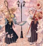  2girls :d black_hakama blonde_hair bouquet cherry_blossoms day dungeon_meshi eye_contact floral_print flower frieren green_eyes hakama highres holding holding_bouquet holding_staff japanese_clothes kitashinamon lamppost looking_at_another marcille_donato multiple_girls outdoors pointy_ears smile socks sousou_no_frieren staff standing trait_connection twintails white_hair wide_sleeves 