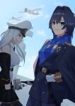 2girls aircraft azur_lane black_coat black_hair blue_coat blue_eyes blue_hair blue_necktie blue_pants caslie_11 closed_mouth coat enterprise_(azur_lane) gloves gradient_hair grey_eyes hair_intakes hat highres hololive hololive_english long_coat long_hair medal medium_hair military_uniform multicolored_hair multiple_girls necktie off_shoulder ouro_kronii ouro_kronii_(4th_costume) outdoors pants peaked_cap uniform virtual_youtuber white_gloves white_hair white_hat wolf_cut 