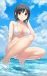  1girl aoyama_sumika bikini black_hair blue_sky breasts brown_eyes cleavage cloud coffee-kizoku commentary_request day highres looking_at_viewer medium_breasts original outdoors short_hair sky solo squatting swimsuit water white_bikini 