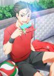  1boy arm_up bag ball black_shorts black_wristband brown_eyes brown_hair bush commentary crew_neck eating food haikyuu!! holding holding_food looking_at_viewer male_focus multicolored_hair nishinoya_yuu open_mouth outdoors popsicle red_bag red_shirt school_bag shirt short_sleeves shorts sitting streaked_hair sueko t-shirt teeth tongue upper_teeth_only volleyball_(object) wristband 