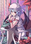  bat_wings blue_hair cake cup food hat highres red_eyes remilia_scarlet saiste short_hair sitting smile solo table touhou wings wrist_cuffs 