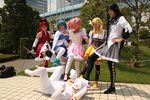  akemi_homura black_hair blonde_hair blue_hair cosplay kaname_madoka kyubey magical_girl mahou_shoujo_madoka_magica miki_sayaka multiple_girls otoko_no_ko pantyhose photo pink_hair red_hair sakura_kyouko stomping tomoe_mami 