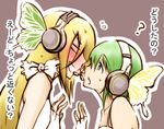  ? blush butterfly_wings face-to-face fingerless_gloves gloves green_hair gumi headphones lily_(vocaloid) lowres magnet_(vocaloid) microphone multiple_girls translated vocaloid wings y@n yuri 