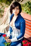  bench bioshock bioshock_infinite black_hair blue_eyes breasts choker cleavage cosplay cropped_jacket elizabeth_(bioshock_infinite) flower looking_at_viewer medium_breasts ormeli photo sitting solo 