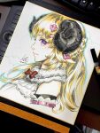  1girl art_tools_in_frame blonde_hair bow closed_mouth commentary cropped_torso detached_sleeves english_commentary from_side hair_ornament highres hololive horns long_hair marker_(medium) photo_(medium) red_bow sheep_girl sheep_horns shikishi signature stanley_lau traditional_media tsunomaki_watame 