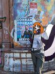 2025 5_fingers anthro beard black_beard black_clothing black_facial_hair black_nose black_text clothed clothed_anthro clothed_female clothed_male clothing draw_over english_description eyebrows eyewear facial_hair female female_anthro fingers fully_clothed fully_clothed_anthro fully_clothed_female glasses graffiti graffiti_on_wall hair hi_res humanoid_hands looking_at_viewer male mammal mephitid multicolored_body natashaarts outside photography_(artwork) poster_(object) real shaded skunk smile smiling_at_viewer snout solo suit text two_tone_body watermark wearing_glasses zohran_mamdani