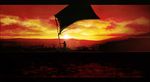  bad_pixiv_id brick_wall cityscape cloud flag from_behind hill horizon lens_flare letterboxed ocean original red_sky silhouette sky solo sun sunset wall ymayc 