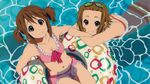  afloat alternate_hairstyle artist_request bikini bikini_skirt breasts cleavage frilled_bikini frills from_above goggles goggles_on_head highres hirasawa_yui innertube k-on! light_smile looking_at_viewer looking_up multiple_girls official_art pink_bikini short_twintails small_breasts striped striped_bikini striped_swimsuit swimsuit tainaka_ritsu twintails water 