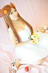  ampharos asian brown_hair cosplay dress gym_leader high_heels long_hair mikan_(pokemon) photo poke_ball pokeball pokemon shoes sitting white_dress 