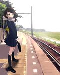  bad_id bad_pixiv_id black_hair brown_eyes day kneehighs lowres original outdoors scarf school_uniform skirt socks solo tactile_paving train_station zukki_(suzukio) 