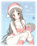  akiyama_mio bad_id bad_pixiv_id black_hair blue_eyes bluez boots breasts cleavage gift hat highres holding holding_gift k-on! long_hair medium_breasts santa_boots santa_costume santa_hat solo 