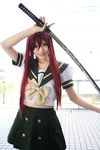  bow cosplay highres long_hair midriff photo red_hair saya-chan school_uniform shakugan_no_shana shana skirt solo sword weapon 