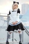  bow cosplay hair_bow maid maid_apron maid_uniform photo scary_eyes striped striped_kneehighs striped_legwear 