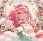  1girl :3 absurdres angel_wings animal_ears apron arknights blush braided_hair_rings cat_ears cat_girl christmas christmas_ornaments commentary goldenglow_(arknights) goldenglow_(maiden_for_the_bright_night)_(arknights) green_jacket hair_rings highres holding_trumpet jacket long_sleeves looking_at_viewer mukaend official_alternate_costume open_mouth pink_hair pom_pom_(clothes) red_sweater short_hair smile solo star_(symbol) sweater symbol-only_commentary upper_body white_apron wings wreath yellow_eyes 