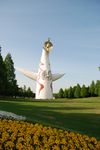  absurdres face flower grass highres japan okamoto_tarou outdoors park photo sculpture tower_of_the_sun tree 