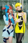  2girls bare_shoulders blonde_hair cosplay emolga flat_chest fuuro_(pokemon) gloves gym_leader kamitsure_(pokemon) long_hair midriff multiple_girls photo pidove pikachu poke_ball pokeball pokeballs pokemon pokemon_(game) pokemon_black_and_white pokemon_bw red_hair short_hair 