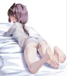  1girl absurdres ass bare_legs barefoot black_hair feet foot_focus foreshortening full_body goddess_of_victory:_nikke green_eyes highres long_hair long_sleeves looking_at_viewer looking_back lying on_stomach rikihana_momo shirt shorts soles toes trony_(nikke) underwear white_background white_shirt white_shorts 