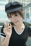  1girl asian bling brown_eyes brown_hair crown female hat highres jewelry kipi-san necklace photo ring short_hair smile solo 
