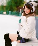  earmuffs gloves highres nozomi_sasaki photo scarf skirt snow sweater thigh-highs thighhighs 