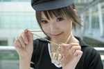  1girl asian bling brown_eyes brown_hair crown female hat jewelry kipi-san necklace photo ring short_hair smile solo 