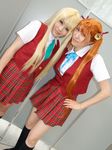  2girls bell bells blonde_hair cosplay hair_ribbon hair_ribbons kagurazaka_asuna knee_socks kneehighs mahou_sensei_negima mahou_sensei_negima! mio mio_(cosplayer) multiple_girls photo ribbon rou rou_(cosplayer) school_uniform serafuku twintails yukihiro_ayaka 