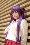  cosplay footwear hair_ribbon hair_ribbons highres hiiragi_kagami lucky_star naito photo purple_hair ribbon sailor sailor_uniform school_uniform serafuku socks twintails 