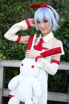  asakura_hina blue_hair bow cosplay hair_bow highres photo pleinair stuffed_animal stuffed_bunny stuffed_rabbit stuffed_toy 