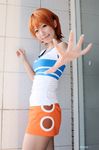  1girl asian cosplay female miniskirt nami nami_(cosplay) nami_(one_piece) nami_(one_piece)_(cosplay) one_piece orange_hair photo shiriru shirt skirt solo striped striped_shirt t-shirt tshirt 